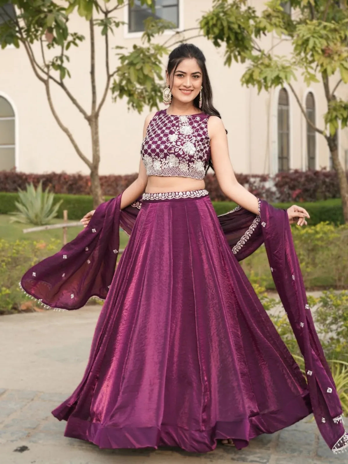 Tarani elegant lehenga in deep purple with flair and dupatta spread, front view showcasing full outfit in natural daylight