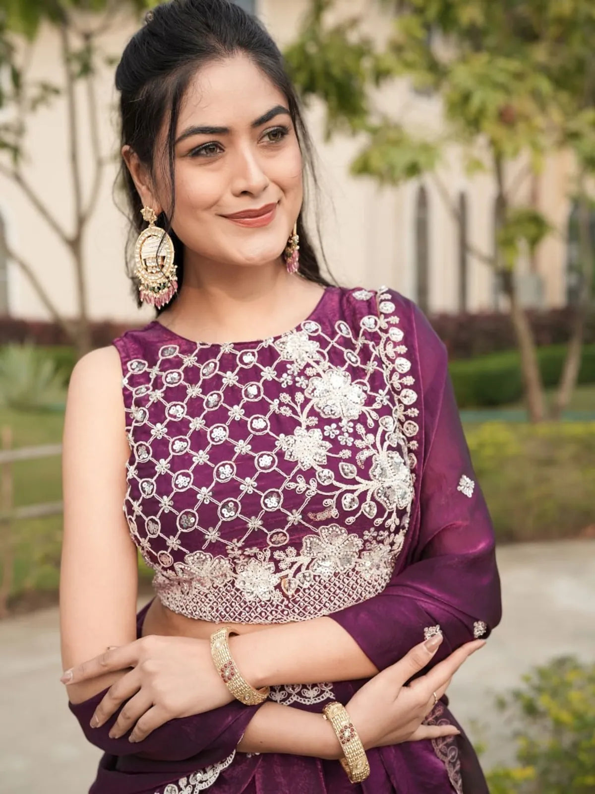 Tarani fendy lehenga in purple shade with premium beads and thread embroidery on blouse, close-up upper body view with earrings