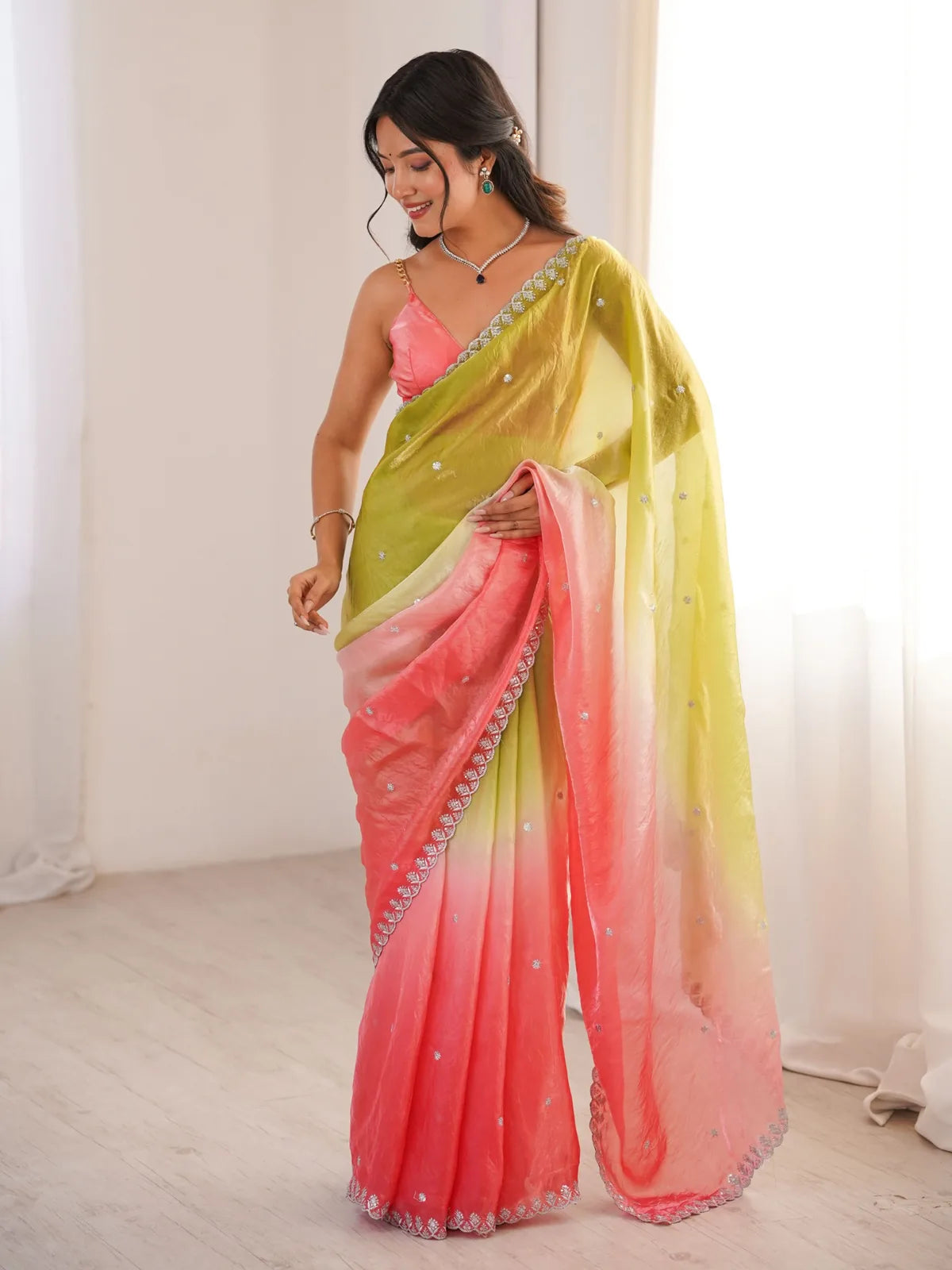Tarani Pradnya green Fendy Satin saree front view with elegant festive drape and sequence work