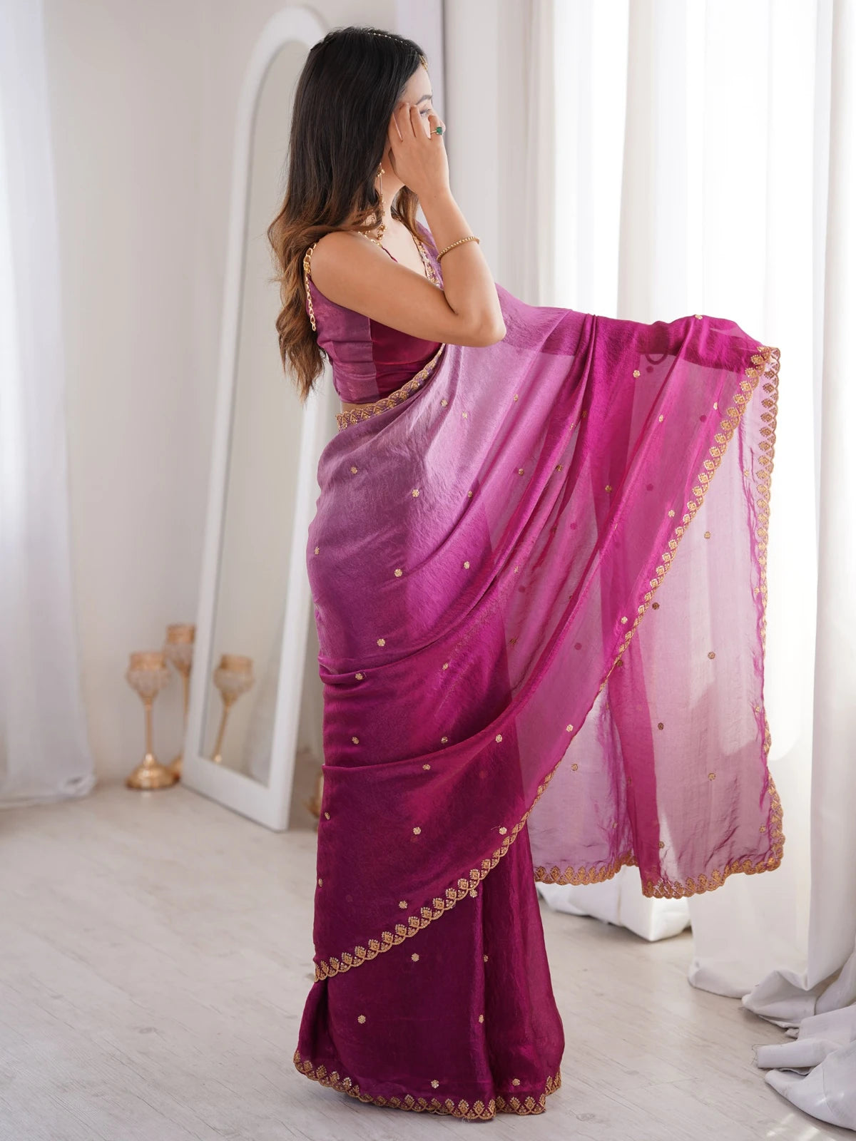 Tarani magenta Fendy Satin saree back view highlighting pallu drape and embroidered border