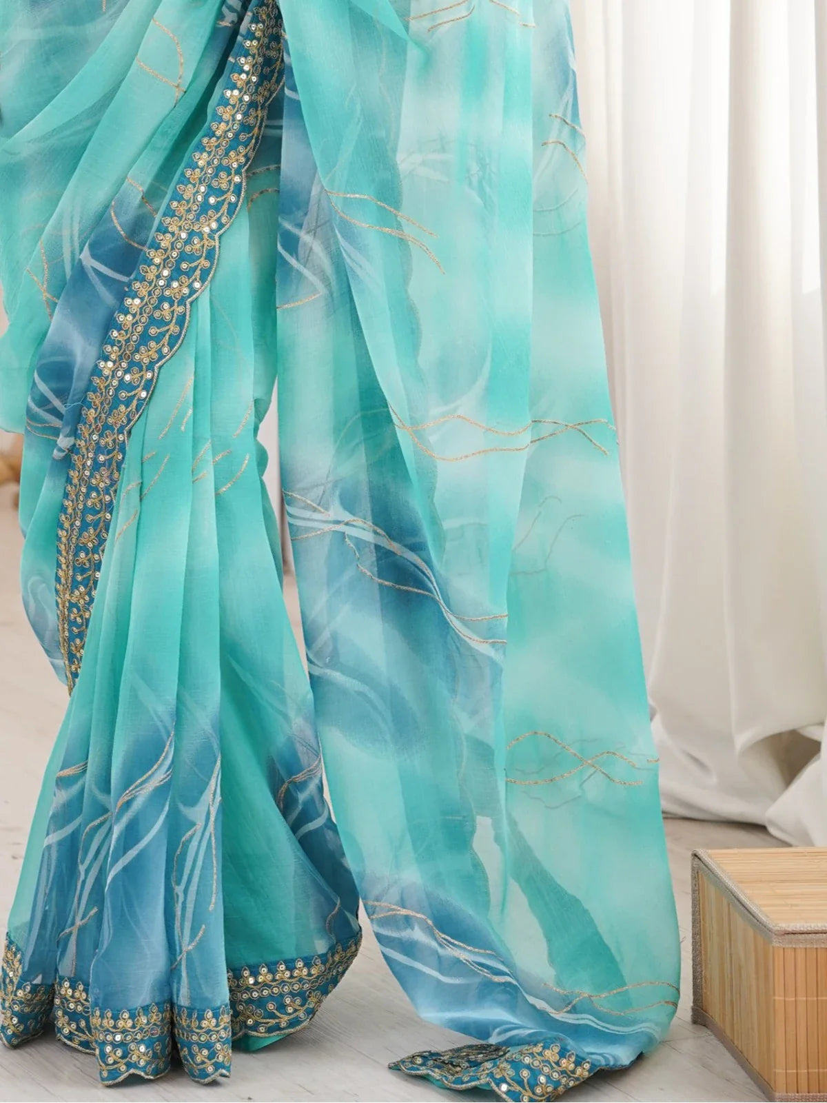 Tarani green chiffon saree closeup showing gold foil laheriya and embroidered detailing