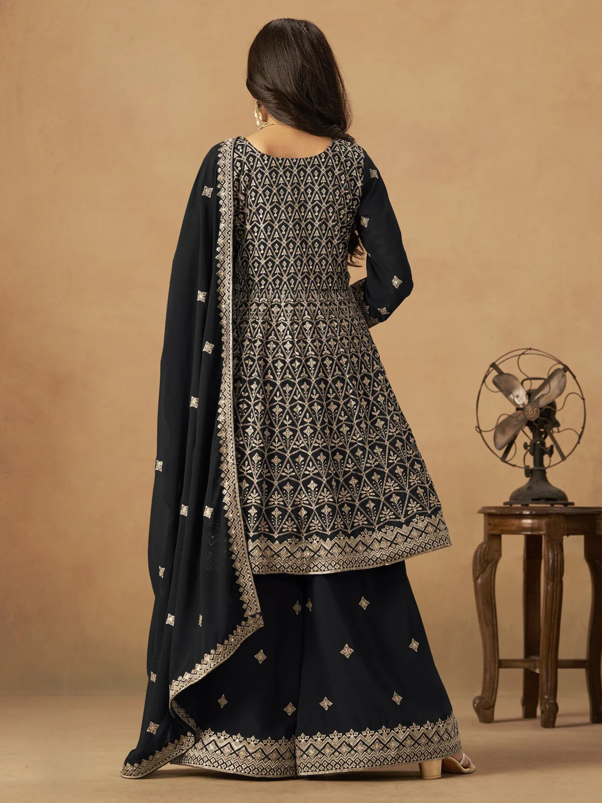 Tarani black georgette dress back view with detailed embroidery