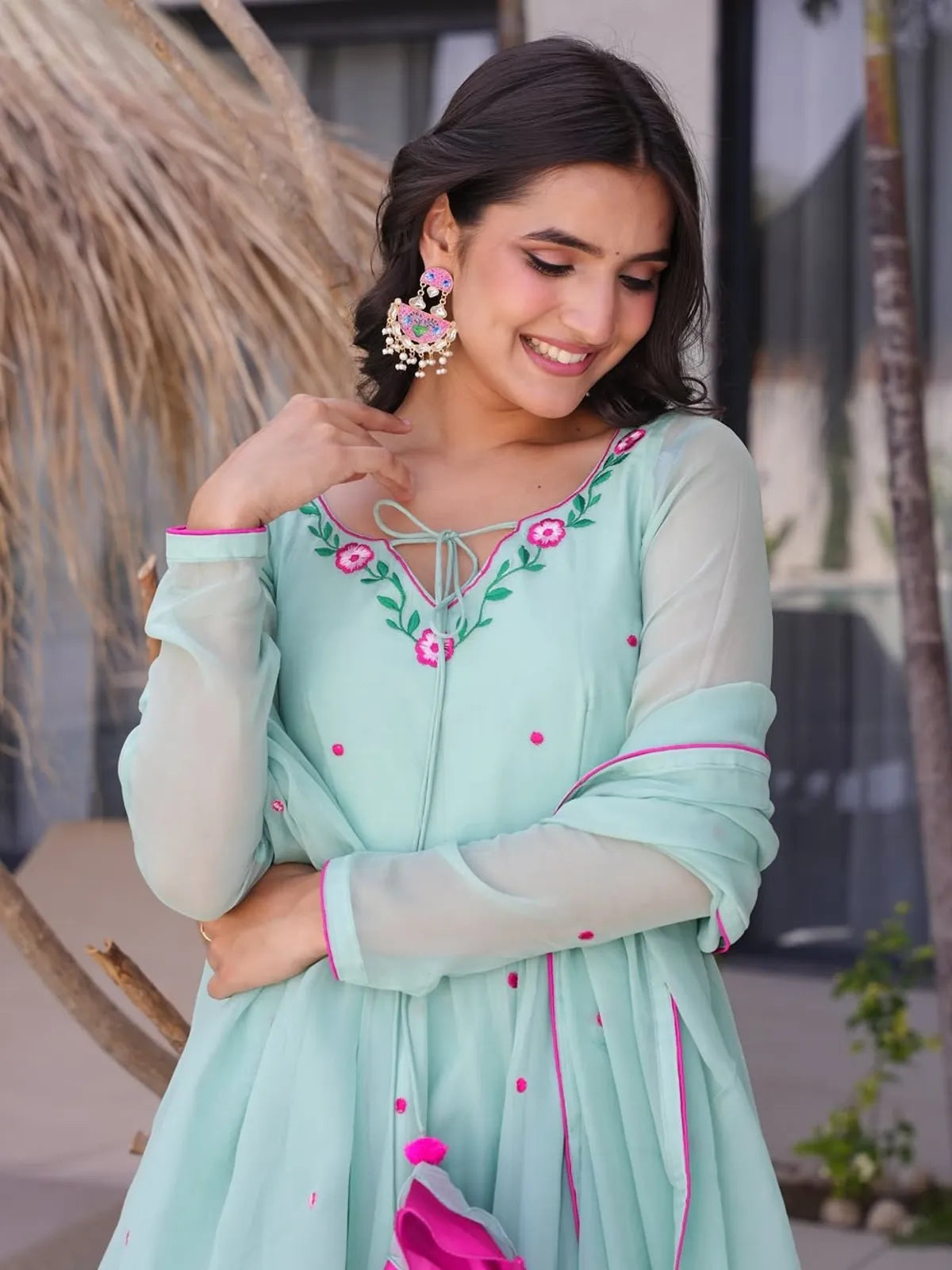 Tarani green georgette embroidered dress upper body view with pink thread detailing - Anila