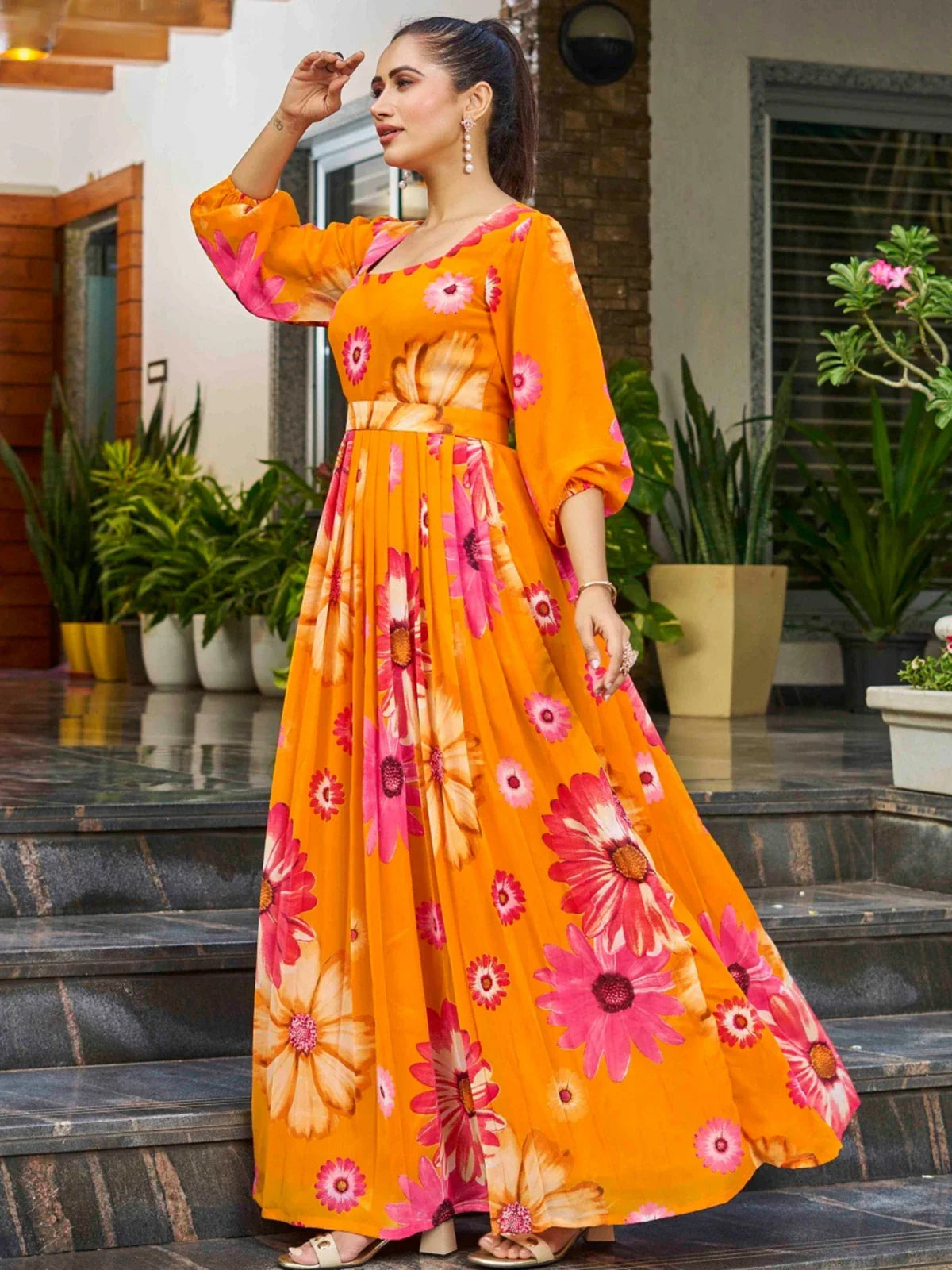 Tarani orange georgette dress with floral print in front view worn by model