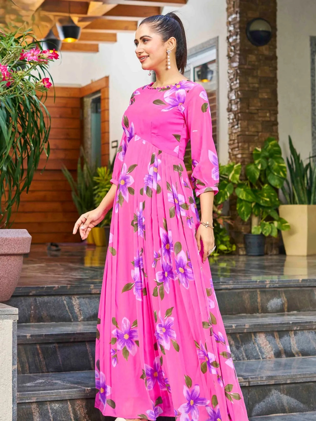 Tarani side view of pink georgette floral dress showcasing elegant drape and long sleeves