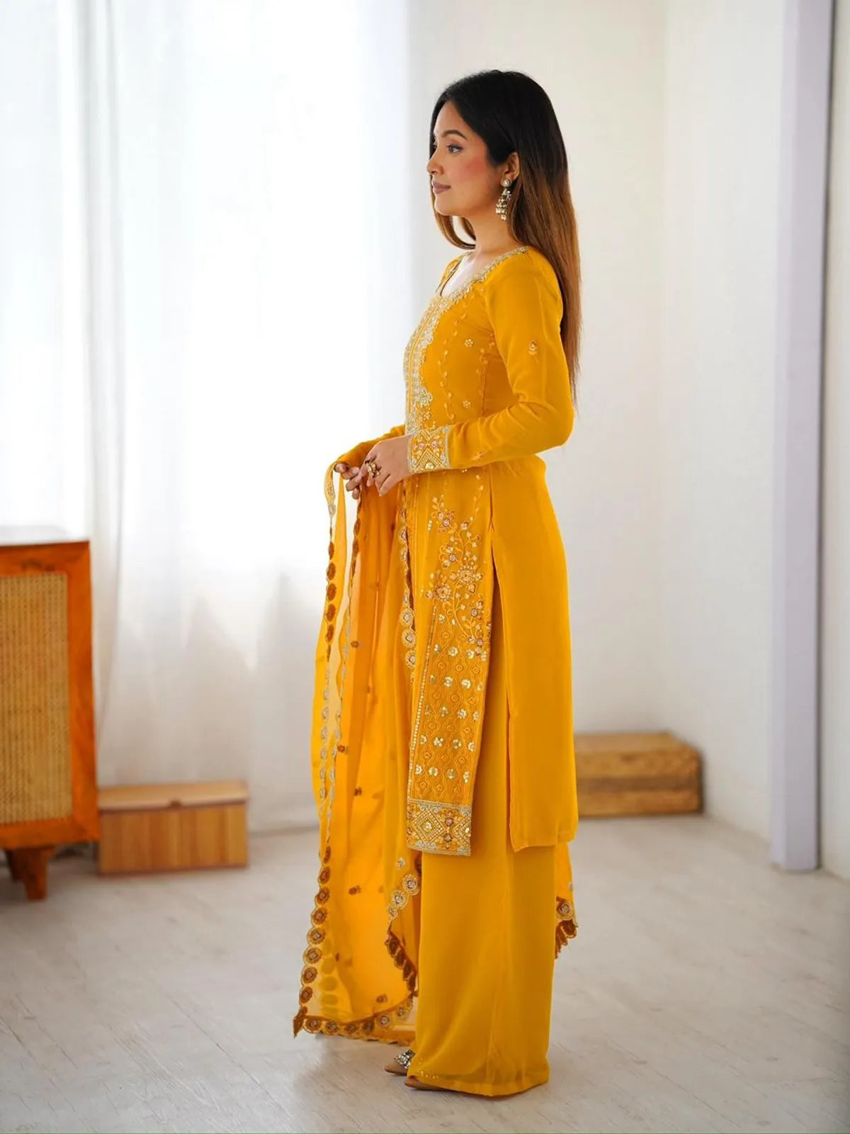 Tarani yellow georgette dress side view showing embroidered sleeve and dupatta