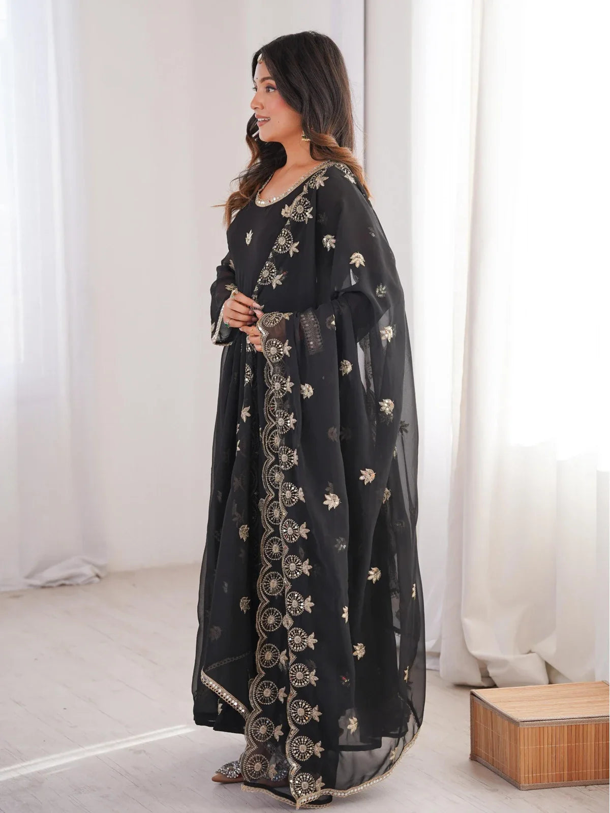 Tarani designer gown in black side profile with embroidered dupatta