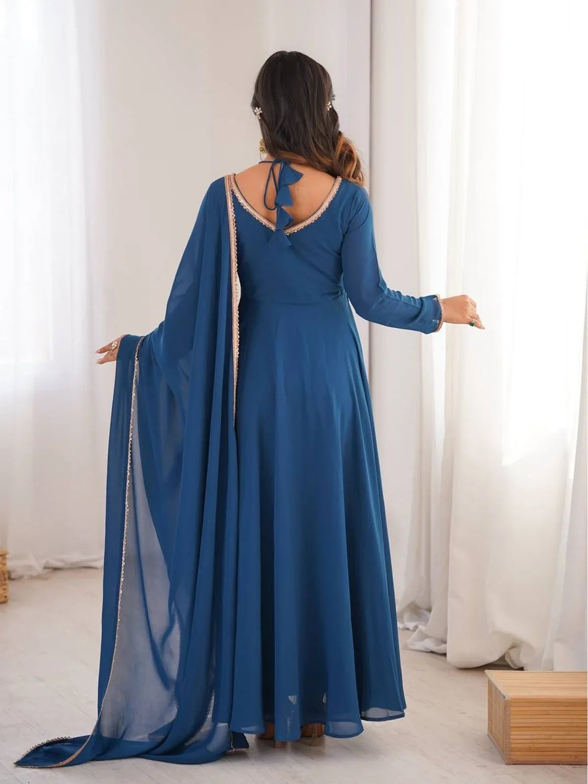 Back view of blue Tarani gown with elegant tie-back neck and georgette dupatta