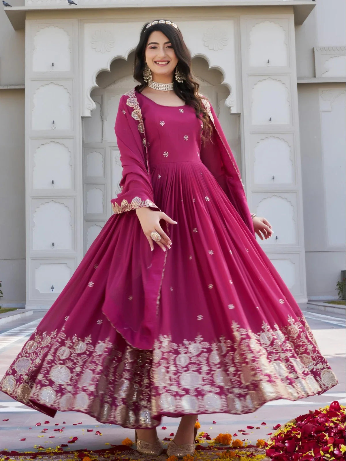 Tarani magenta georgette gown front view with flowing flair and elegant drape