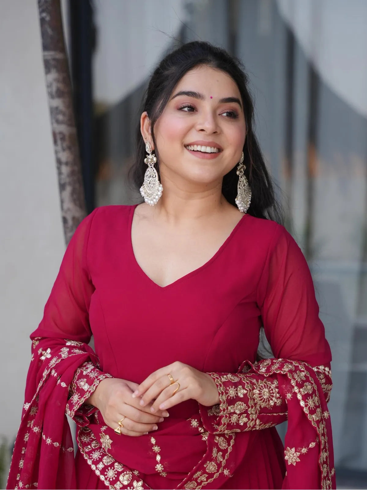 Tarani maroon georgette gown close-up upper body with sheer sleeves and V-neck