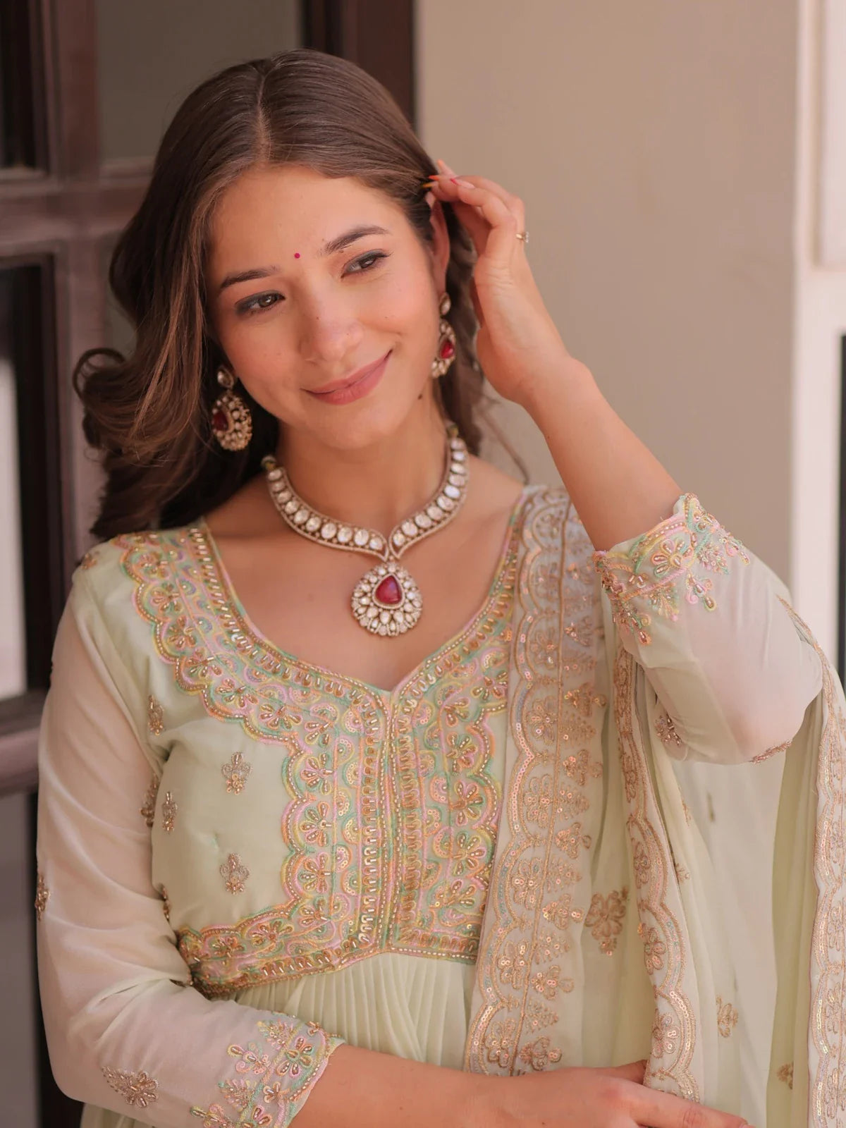 Tarani mint green georgette embroidered gown upper body close-up