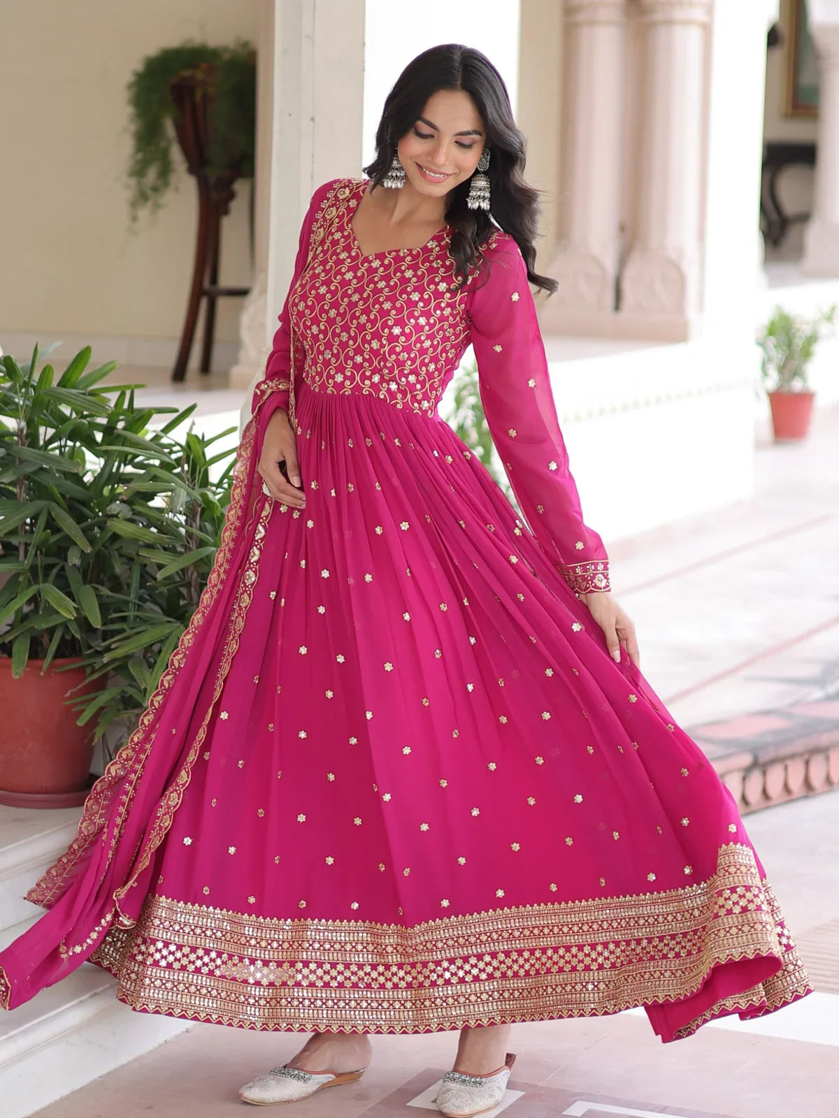 Tarani pink embroidered georgette gown front view with full flare and festive styling