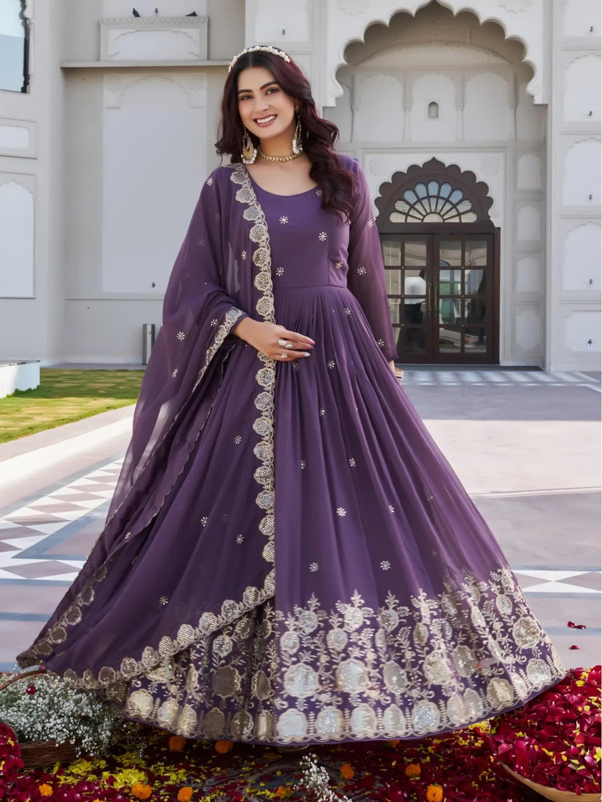 Tarani purple georgette gown front view with flare and gold embroidery on hem - Ishivitika
