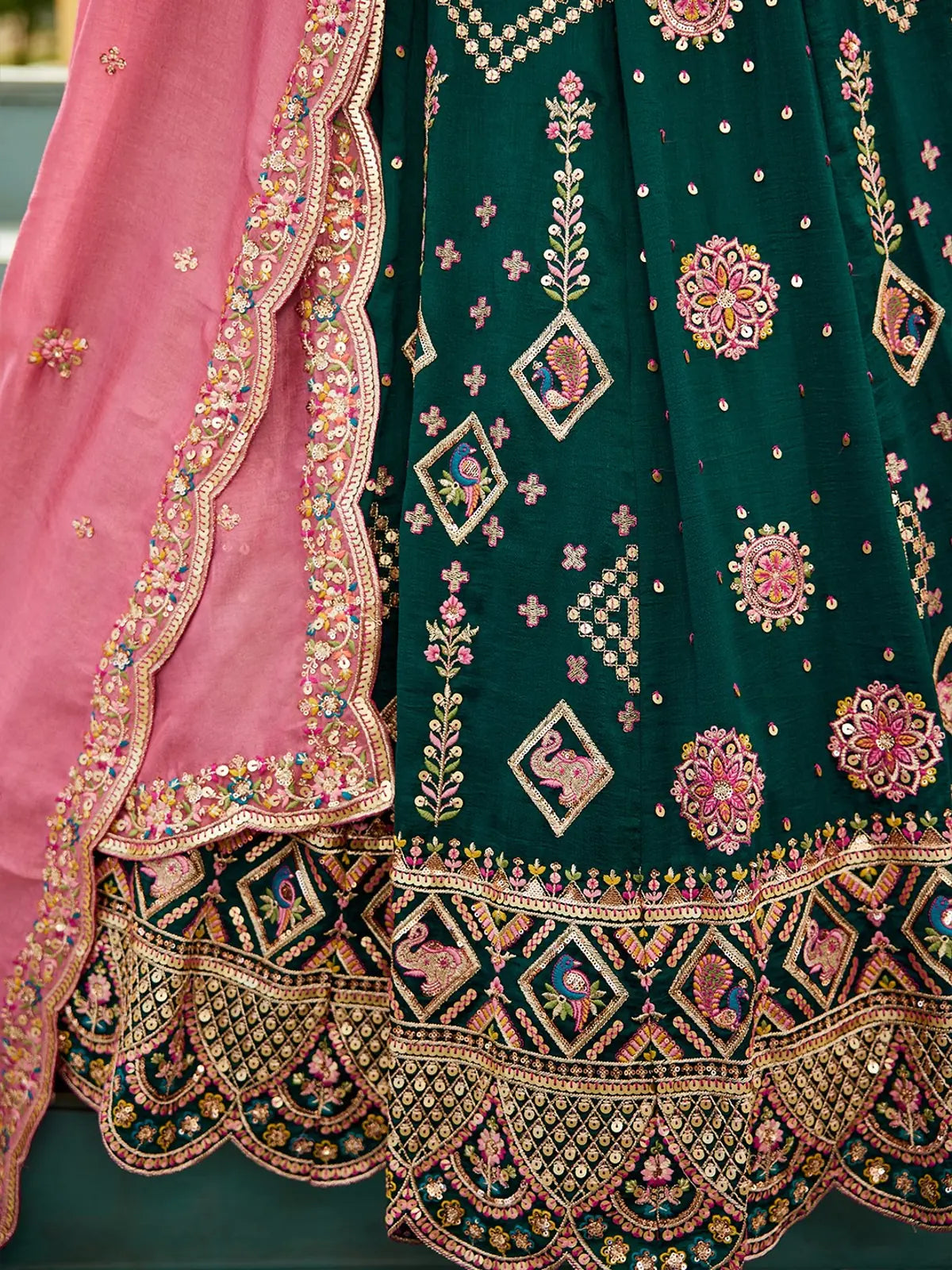 Tarani detailed embroidery of green lehenga with floral and peacock motifs and pink dupatta border Ashmika