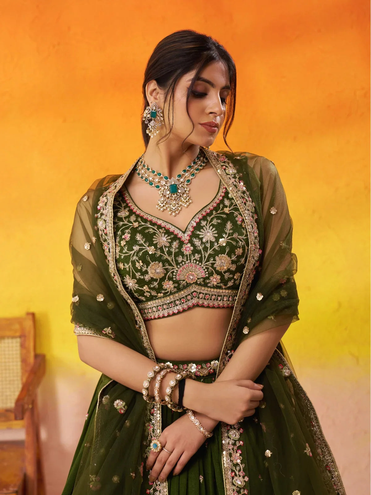 Tarani premium bridal lehenga upper body view with sweetheart blouse and jewellery