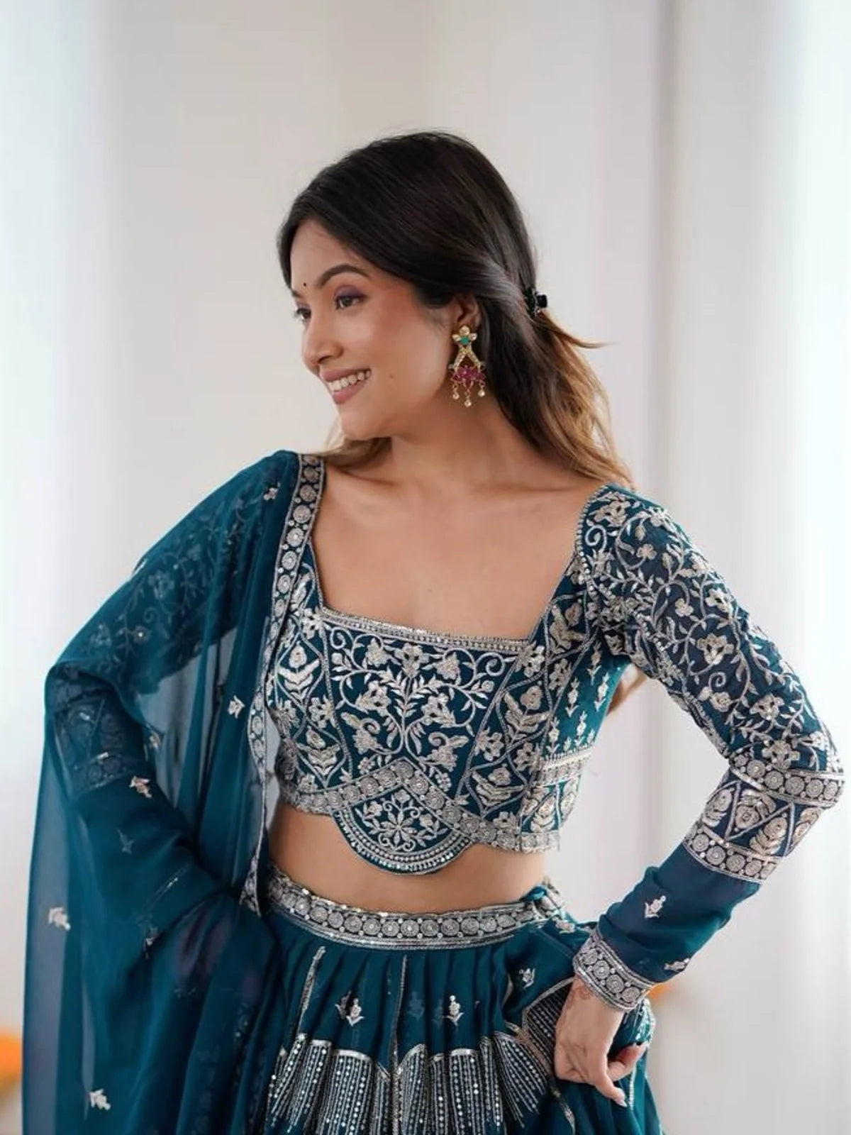 Tarani teal georgette lehenga blouse with silver thread embroidery and close-up front neckline
