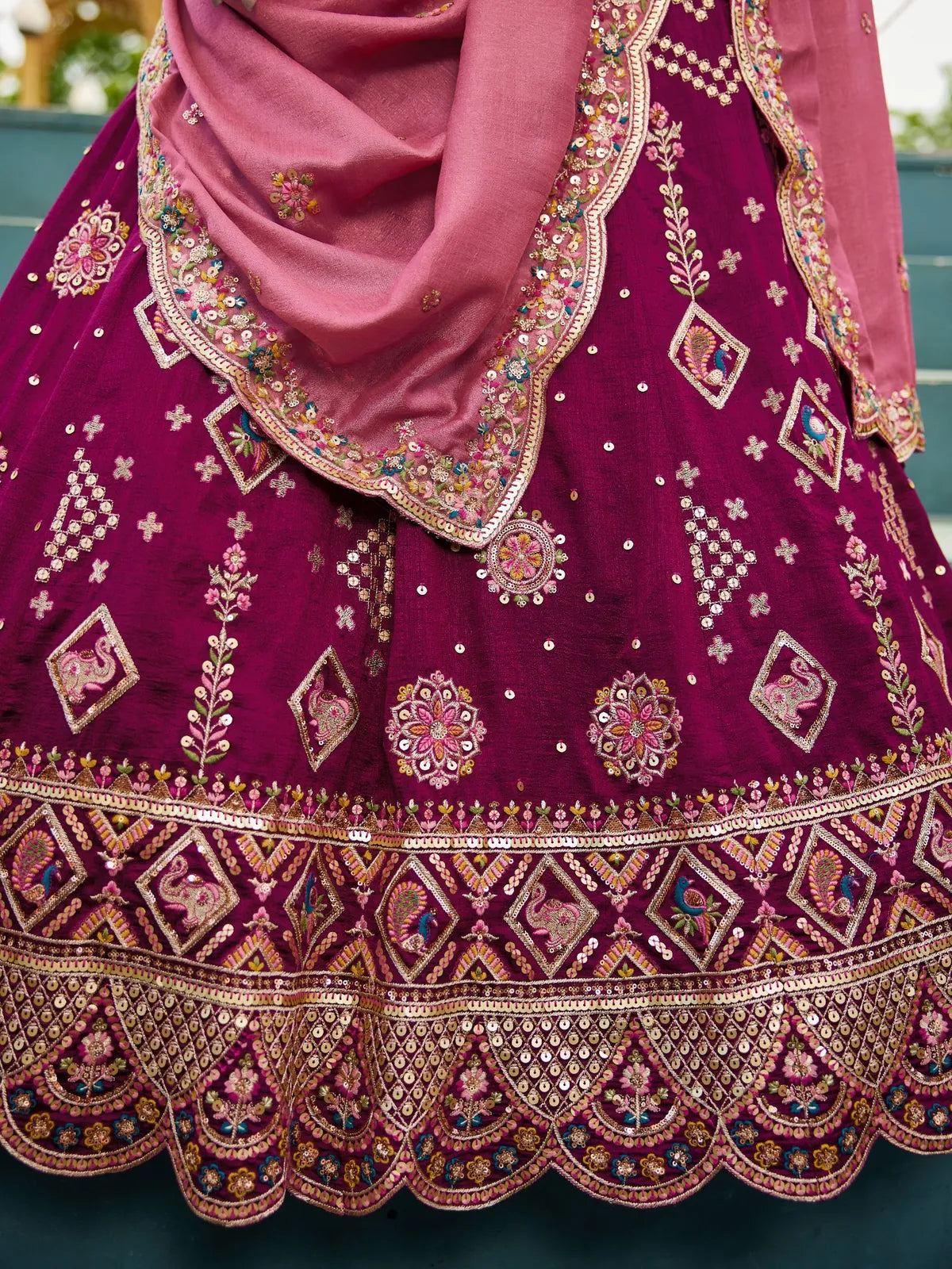 Tarani magenta georgette lehenga closeup showcasing sequin embroidery and border detailing