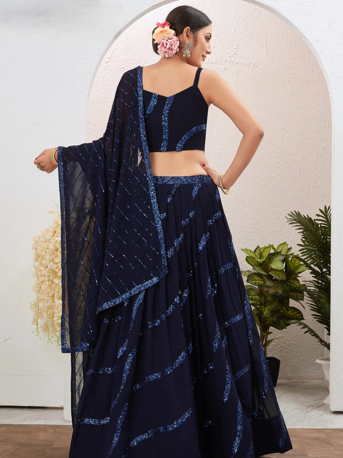 Tarani back view of navy blue georgette lehenga with dupatta and stitched blouse