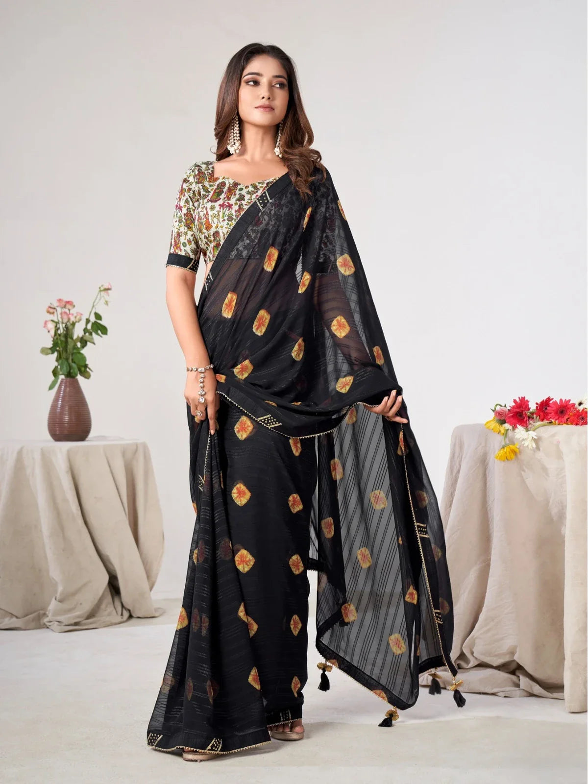 Tarani premium black georgette saree with printed silk blend blouse for festive and party wear