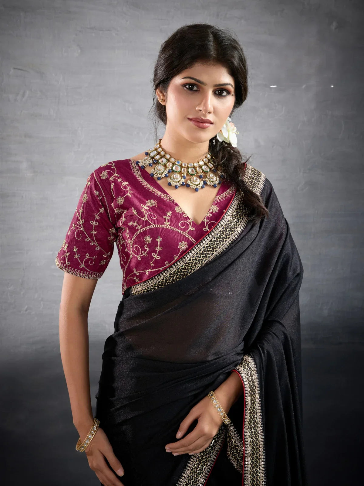 Tarani black georgette saree upper body view with contrast embroidered blouse, elegant party look