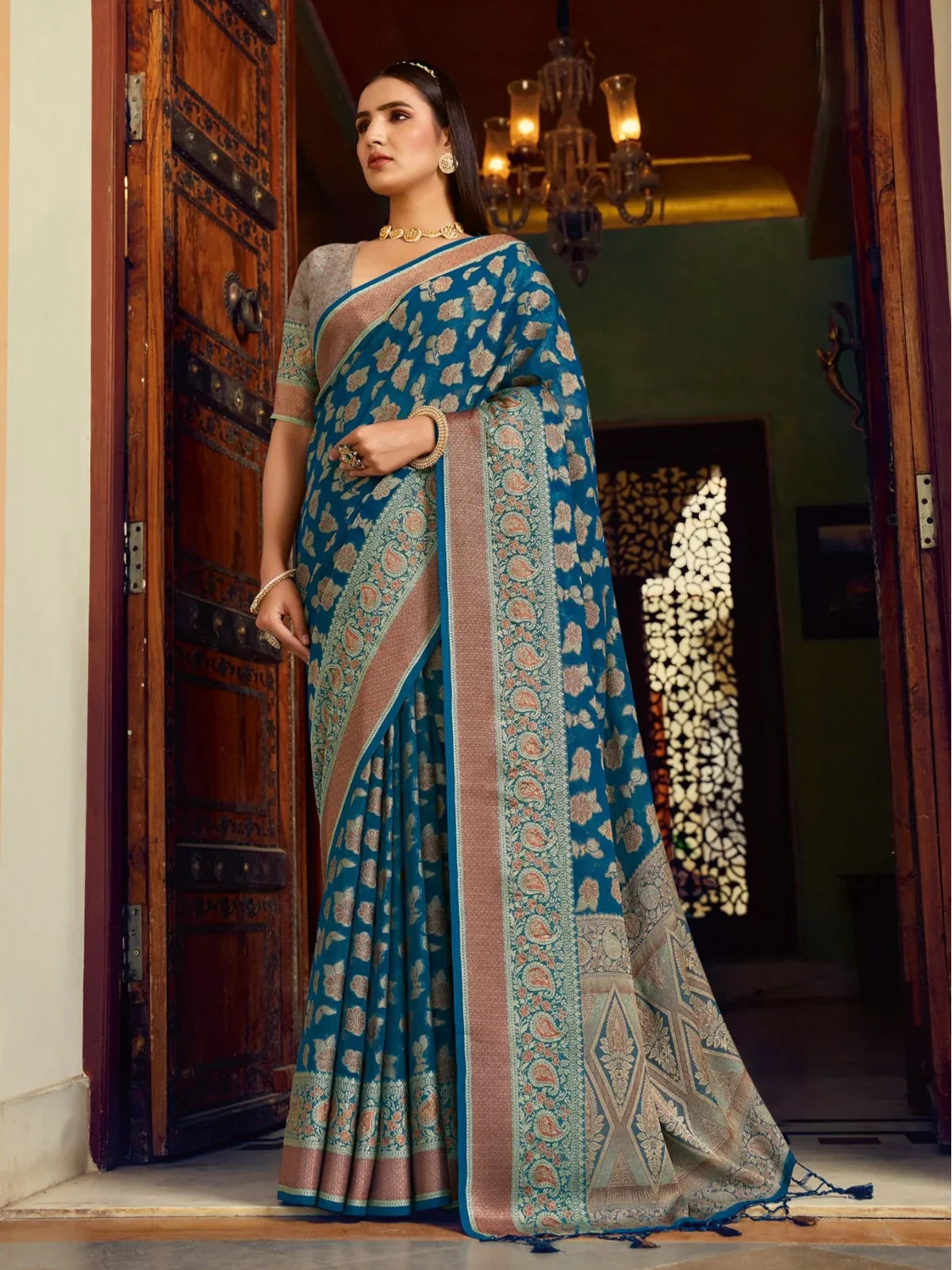 Tarani premium blue georgette saree with weaving buta border and pallu for party and festive wear