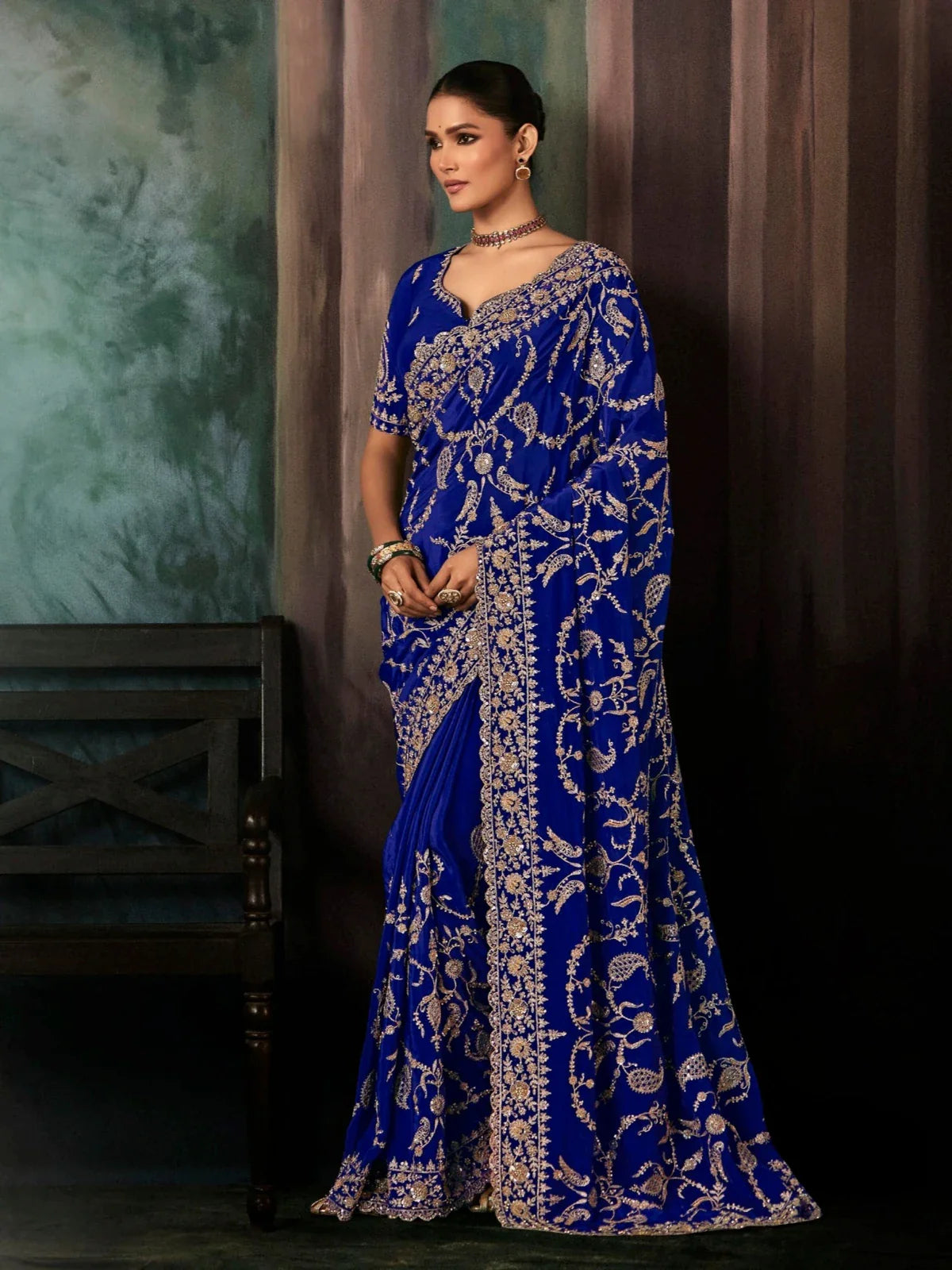 Tarani blue georgette saree full view with heavy golden embroidery and elegant drape