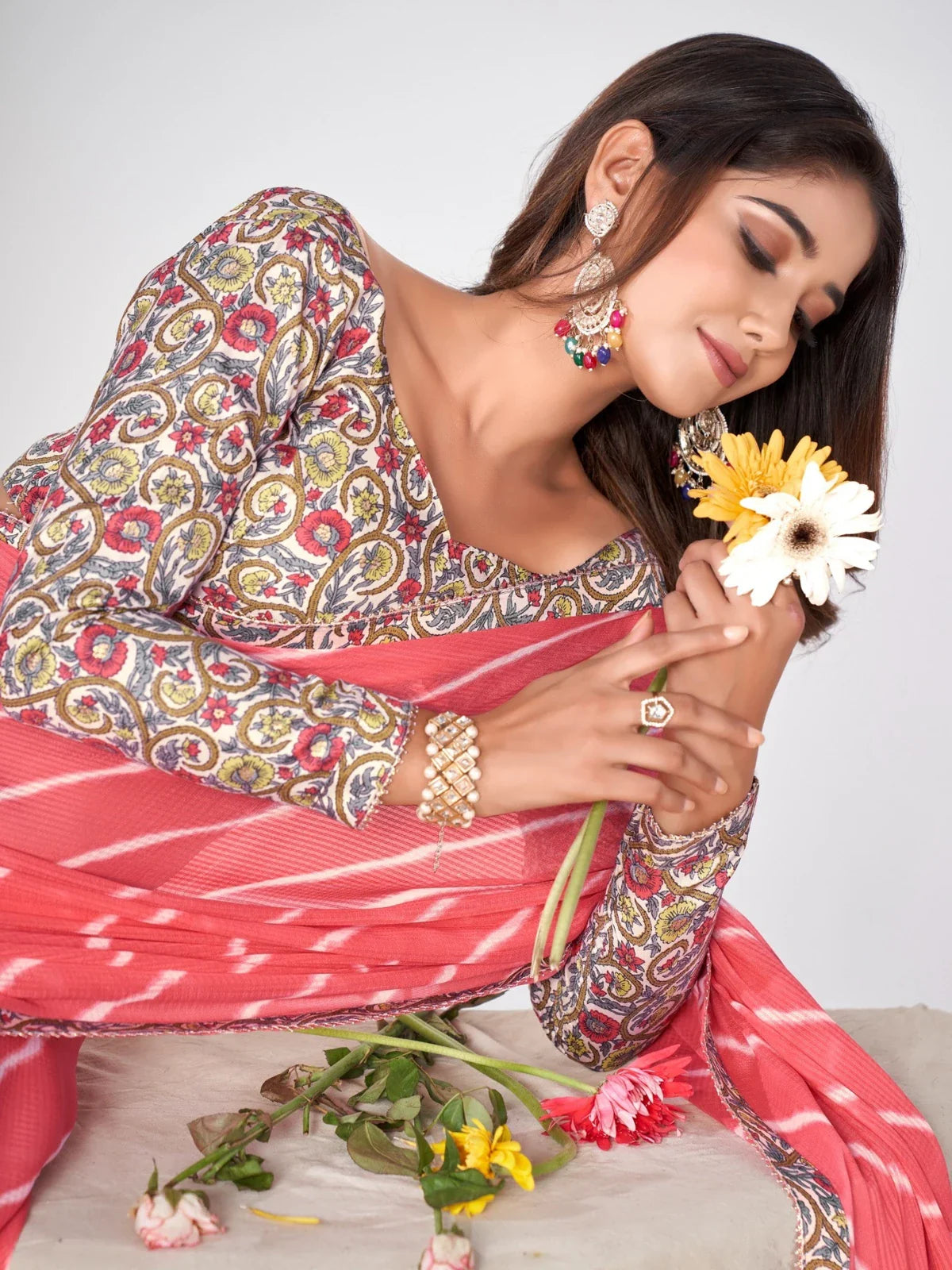 Tarani upper body view coral pink georgette saree with floral silk-blend blouse close look