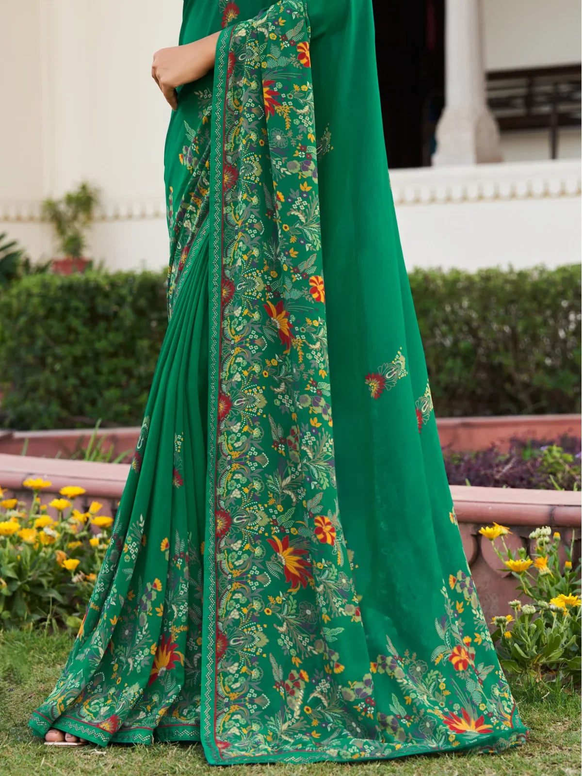 Tarani green georgette saree pallu view showing detailed floral print border