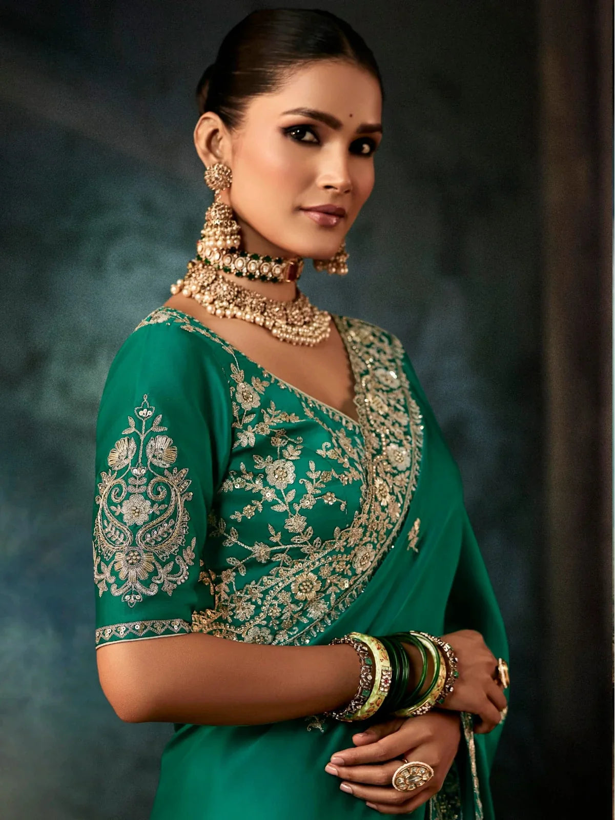 Tarani green georgette saree upper body view with detailed zari embroidery on the blouse