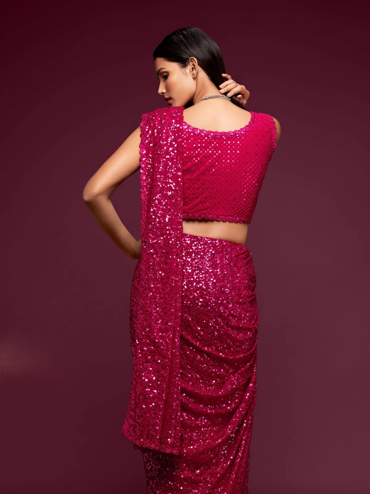 Tarani magenta embroidered georgette saree back blouse view with shimmering sequins work