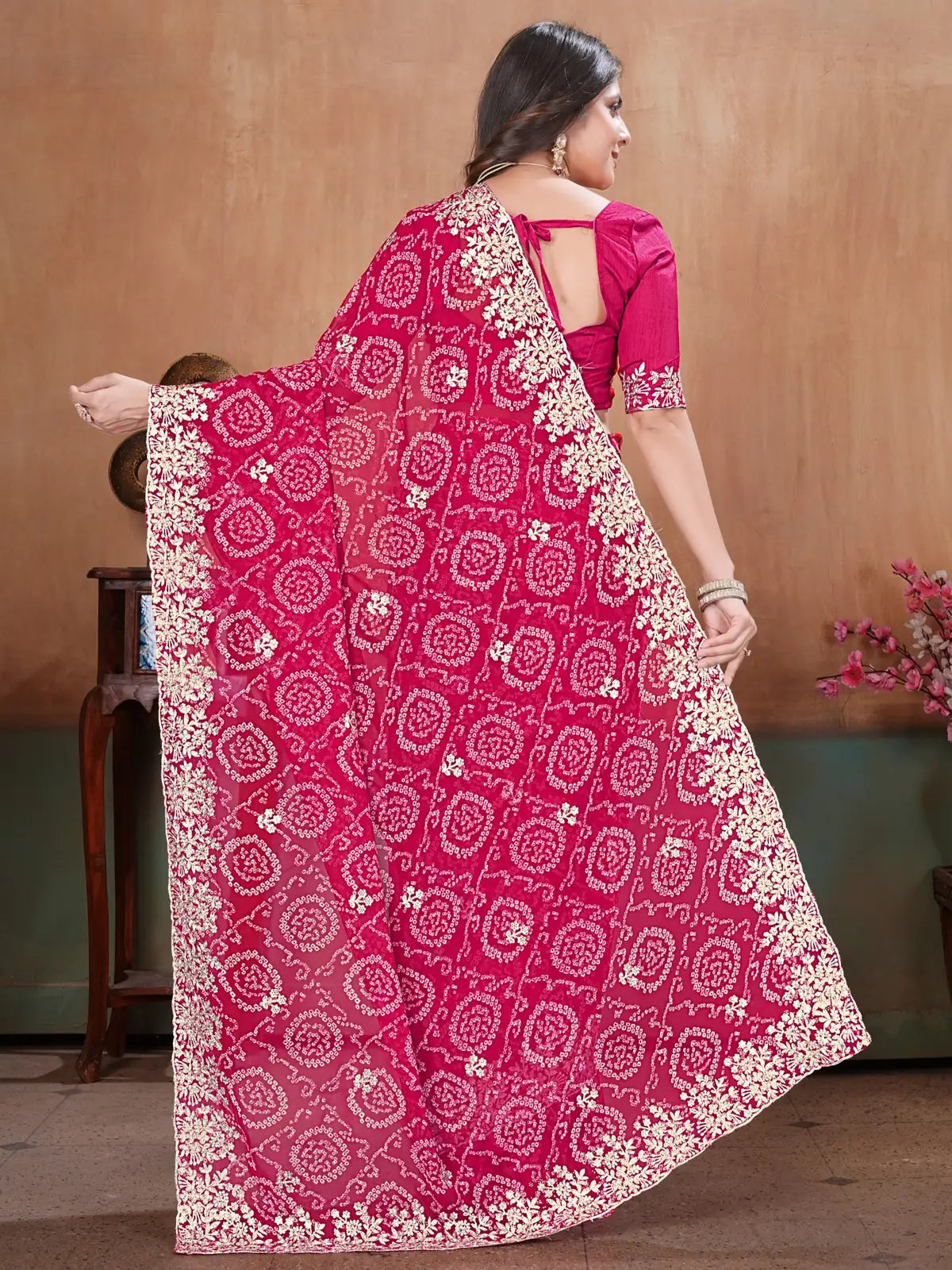 Tarani magenta georgette Bandhini saree back view with embroidered border