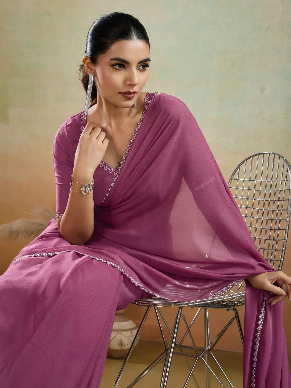 Tarani magenta georgette saree upper body close shot with lace detail