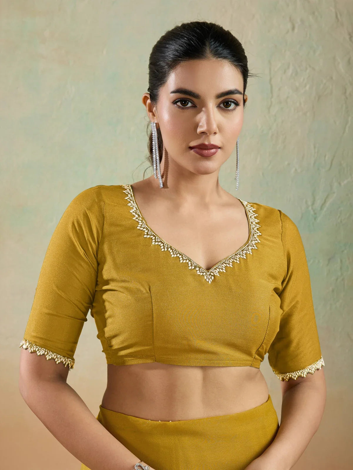 Tarani mustard georgette saree with elegant blouse close neckline in upper body view