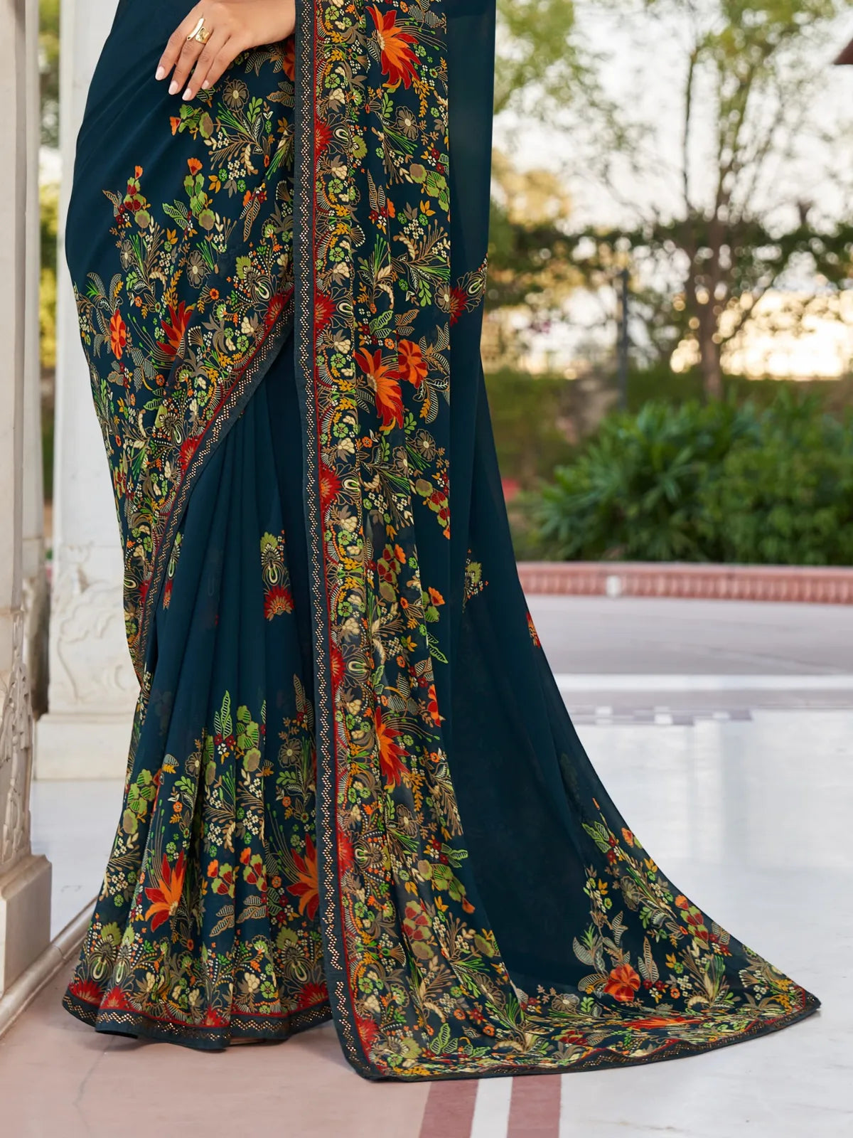 Tarani navy blue georgette saree pallu view highlighting floral patch border work