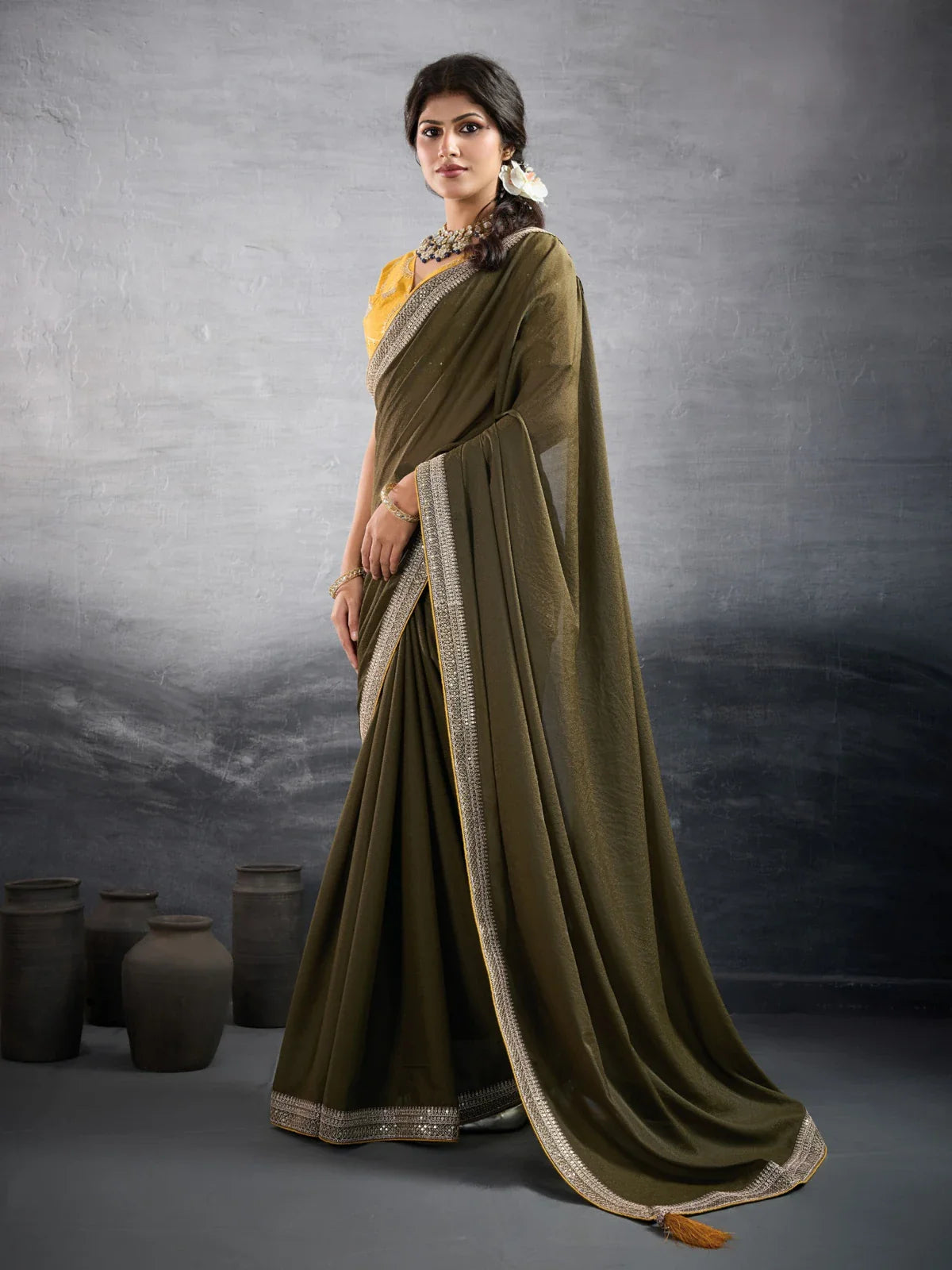 Tarani olive green georgette saree with heavy border and embroidered blouse for festive wear