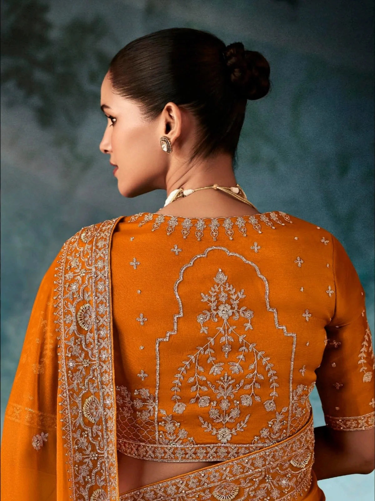 Tarani vishnupriya Orange Georgette saree drape detail view for festive party and wedding wear