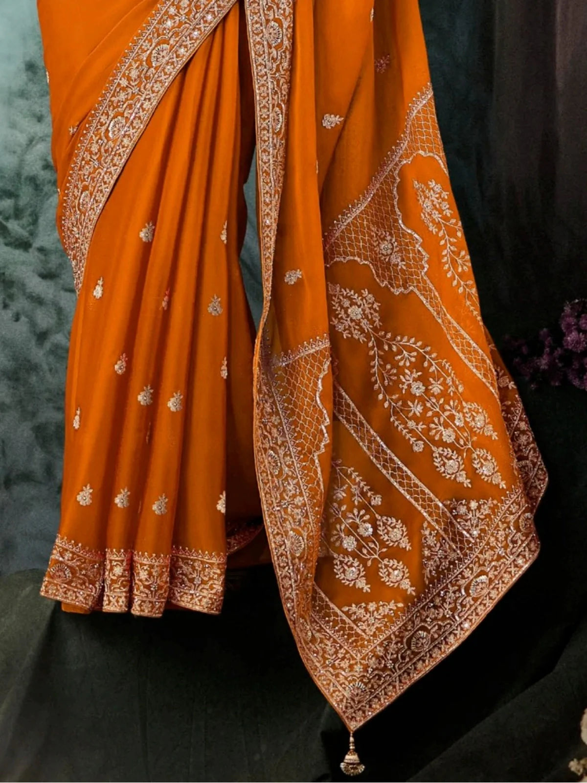 Tarani vishnupriya Orange Georgette saree close up view for festive party and wedding wear