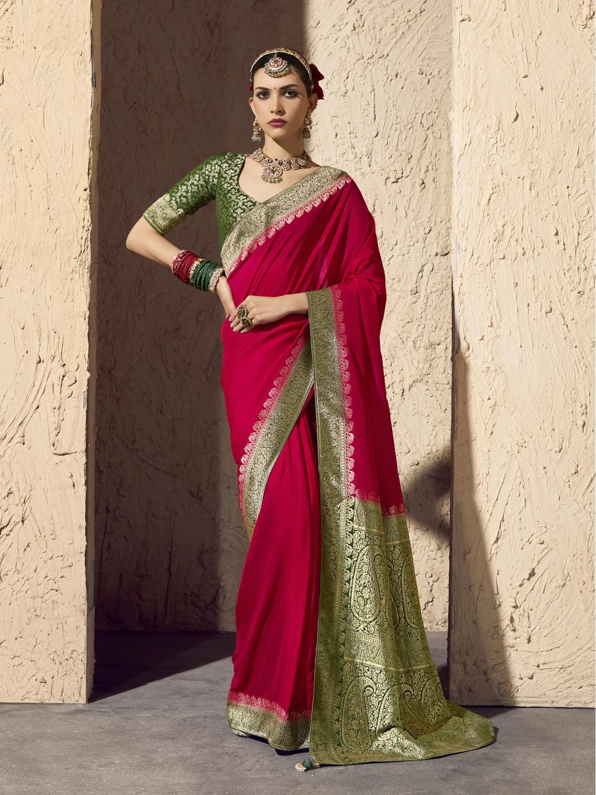 Tarani premium pink georgette saree with antique green blouse and zari pallu for festive and wedding wear
