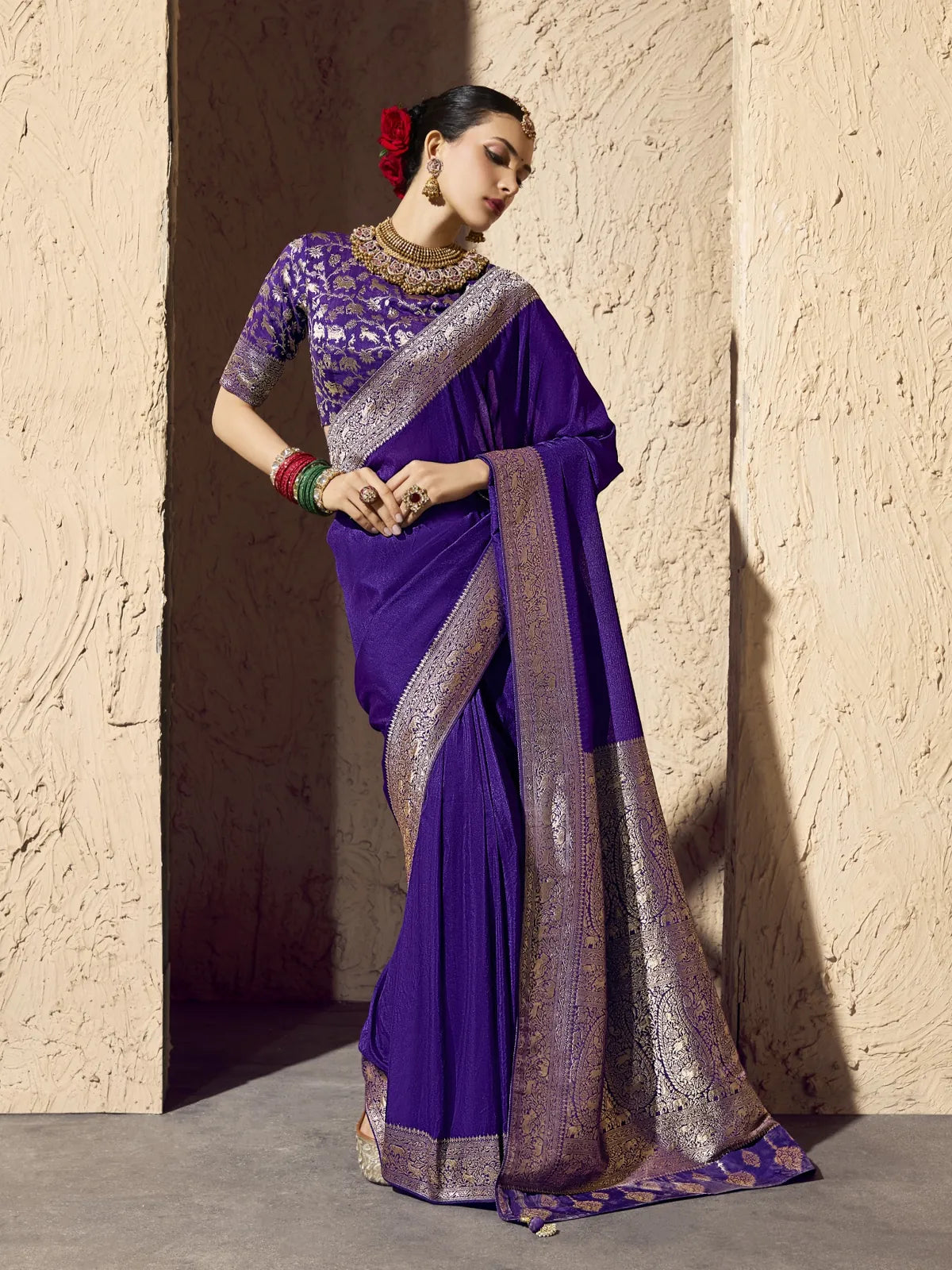 Tarani purple georgette saree with zari weaving and designer blouse for festive wear
