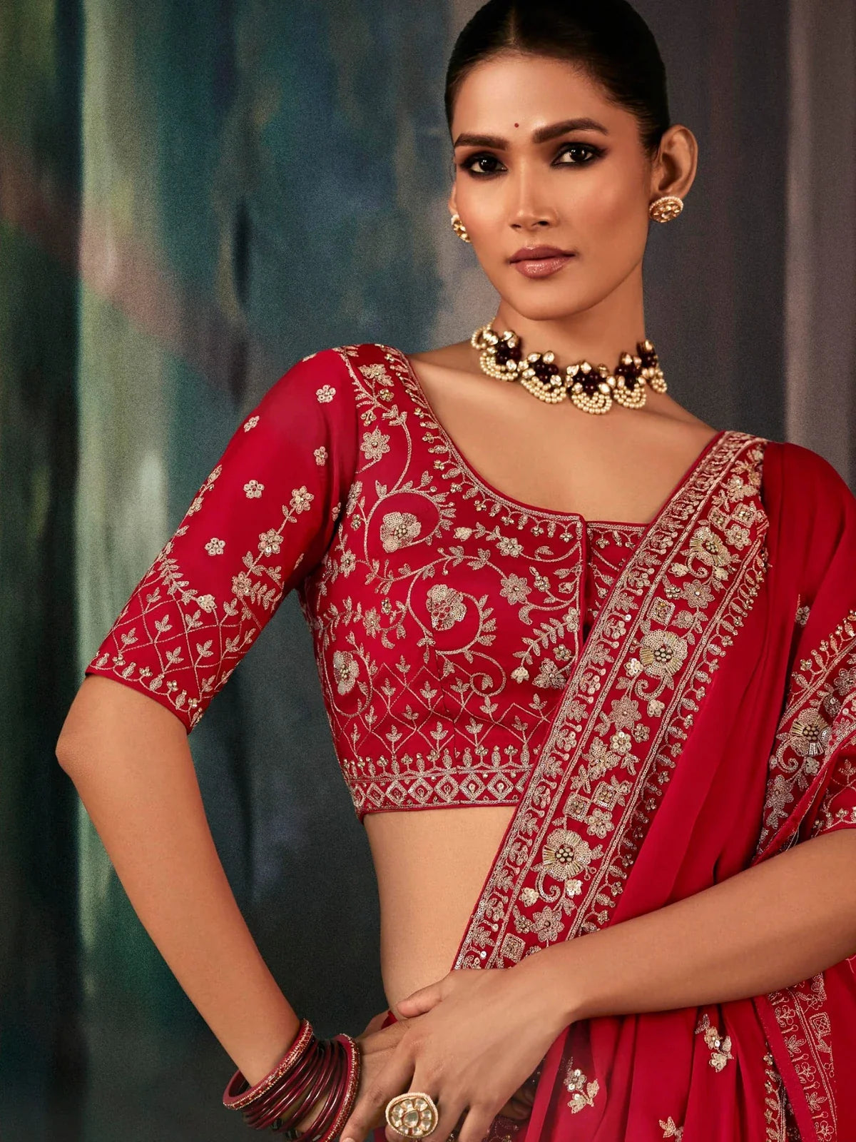 Tarani red georgette saree with intricate zari work blouse close-up view
