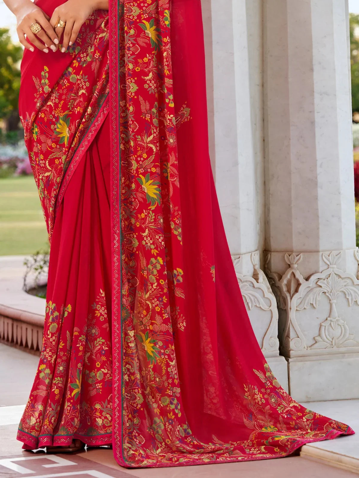 Tarani red georgette saree close pallu view with floral border detailing
