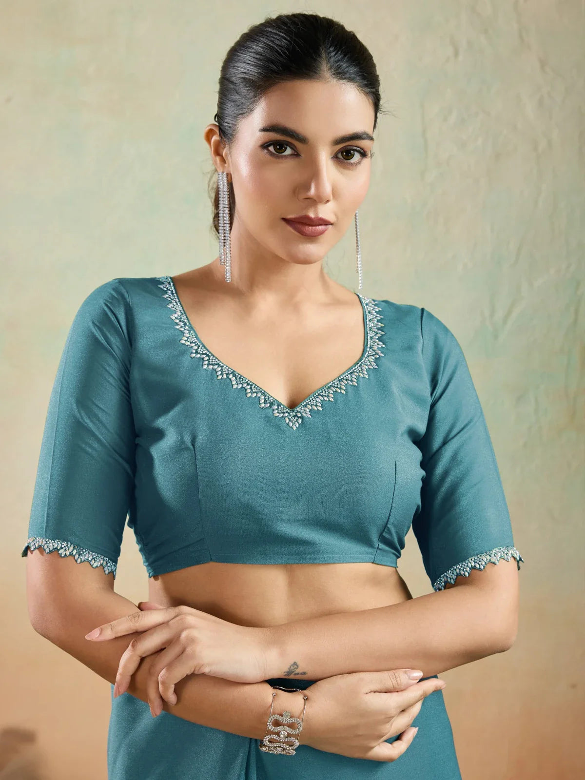 Tarani teal georgette blouse with lace sleeve design close-up view