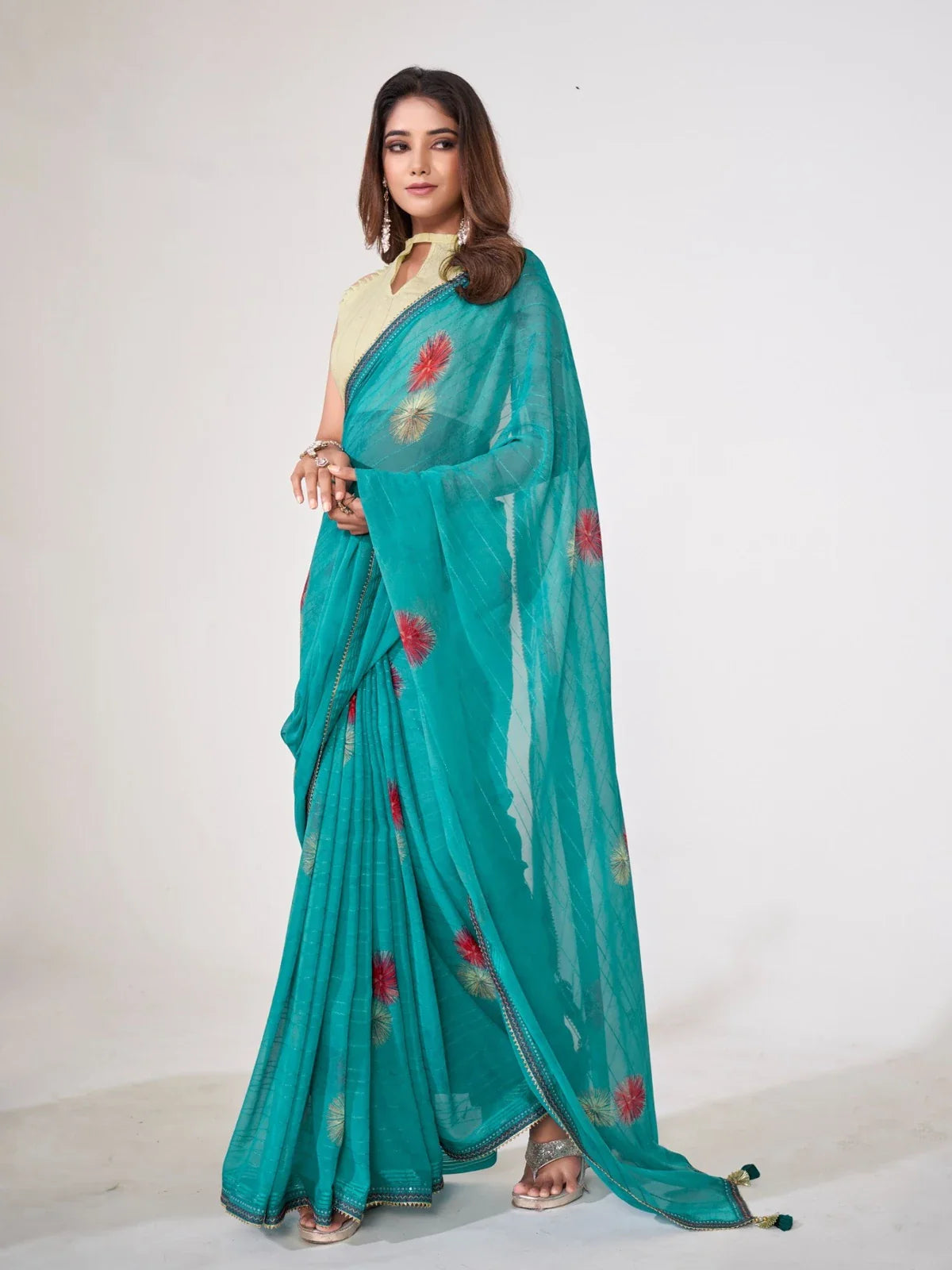 Tarani premium teal georgette festive saree with silk blend blouse and floral work
