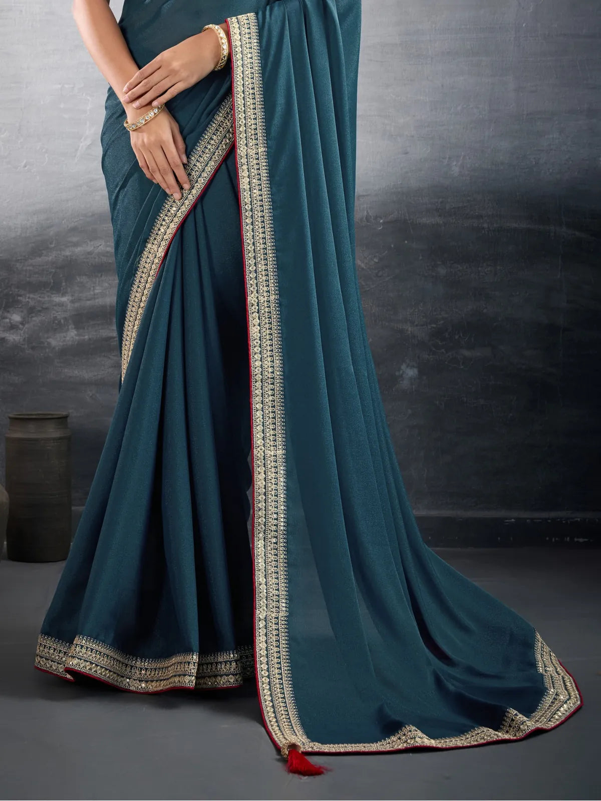 Tarani teal georgette saree pallu view highlighting intricate border design