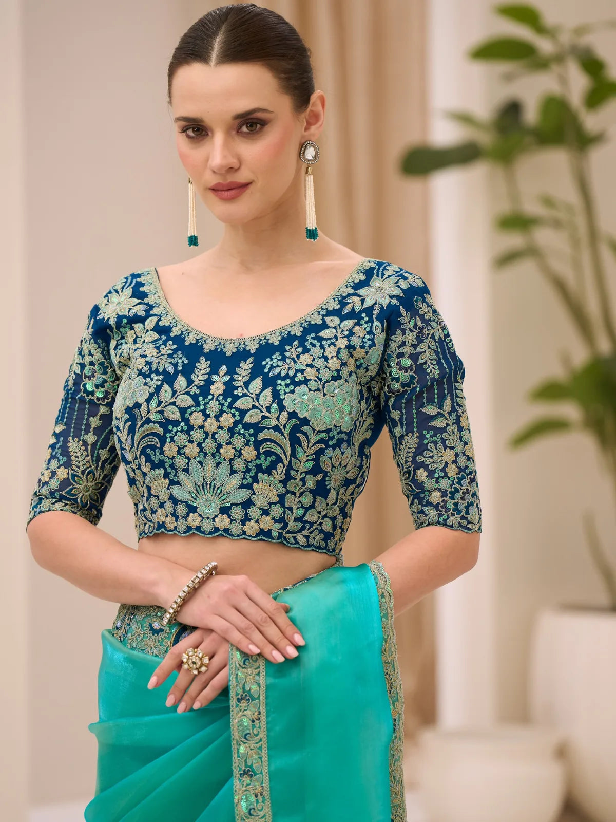 Tarani teal blue embroidered blouse and saree upper body view Arshiya