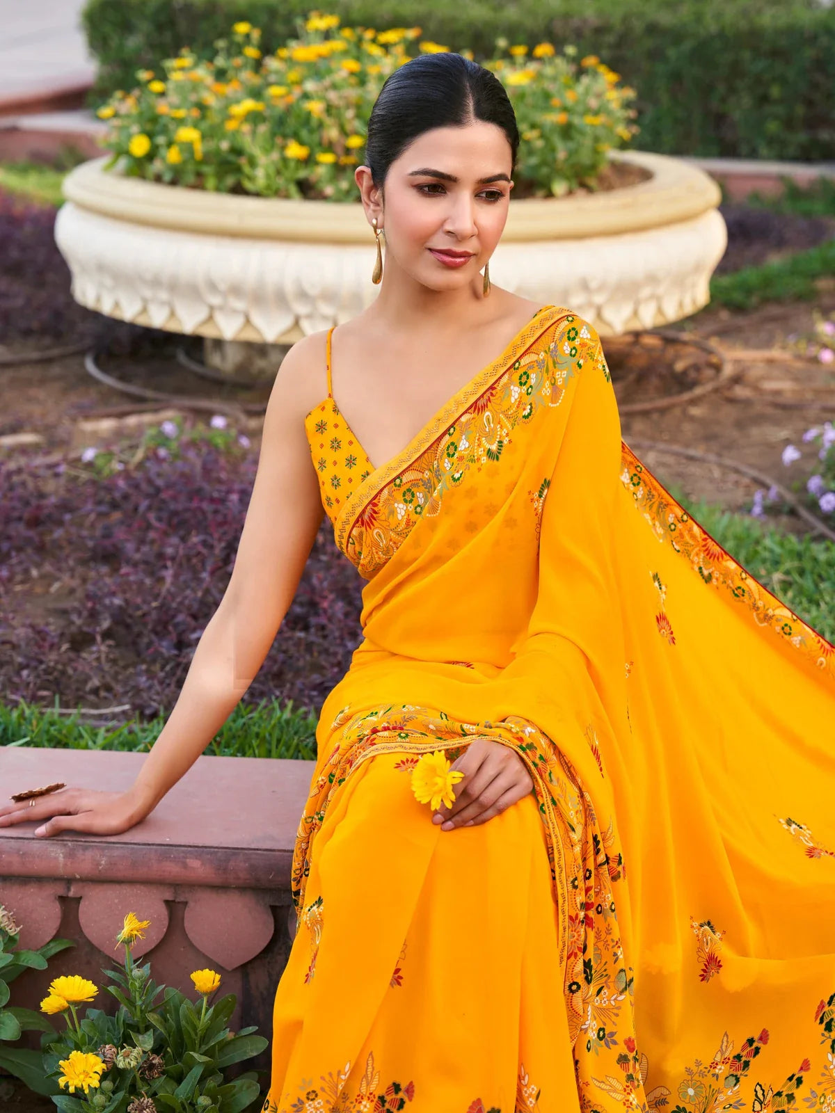 Tarani yellow georgette saree front view with floral print and patch border work for party wear