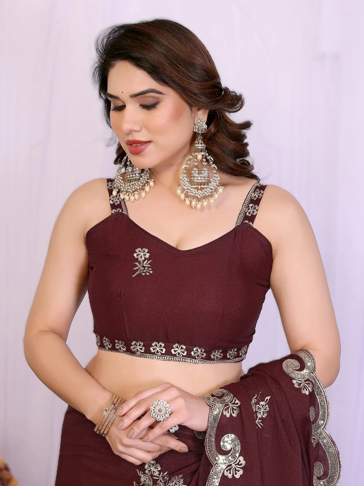 Tarani embroidered georgette silk saree close-up showing blouse neckline and thread work