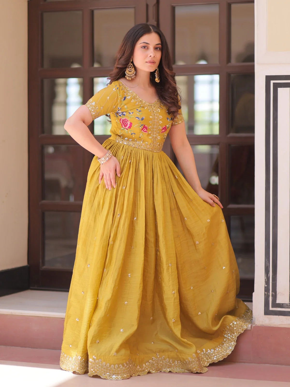 Tarani gold crush yellow gown front view showcasing full flair and mirror work
