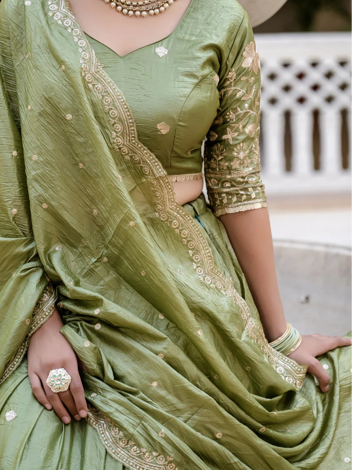 Tarani green gold crush lehenga blouse closeup view showing intricate craftsmanship