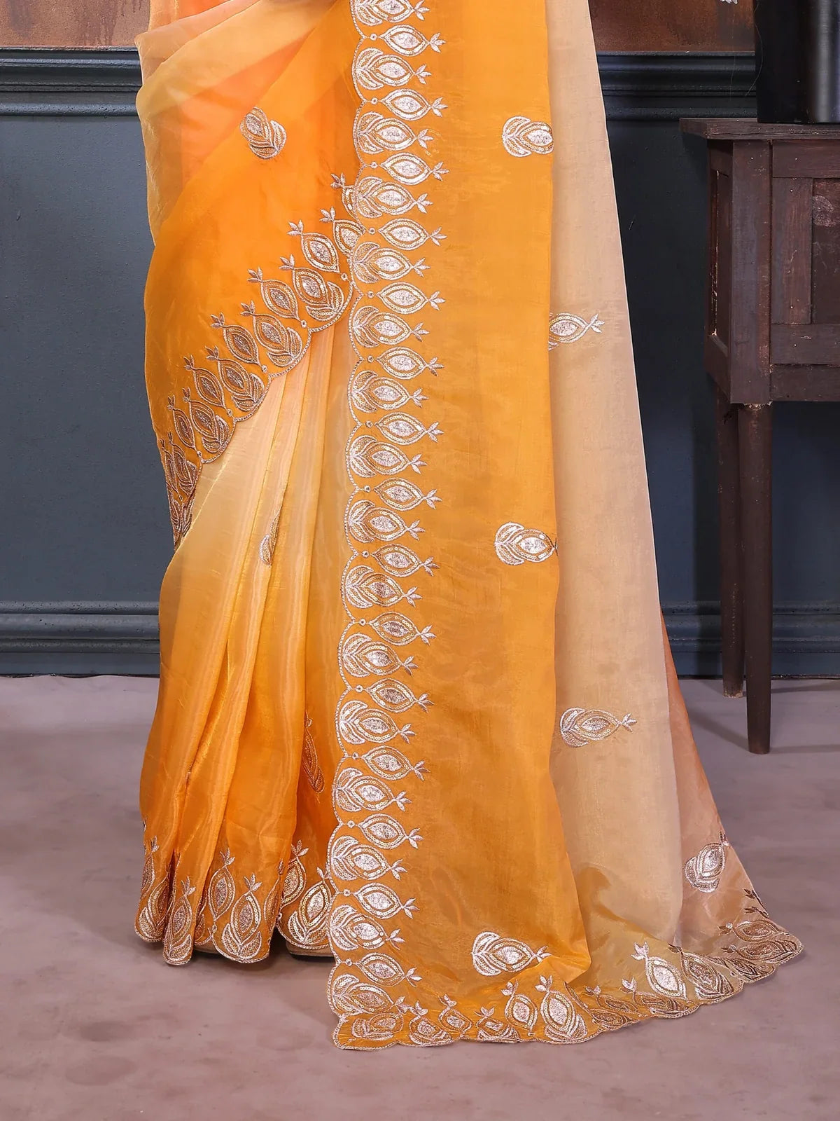 Tarani pallu and border embroidery details on gold crush silk saree in orange tone for party look